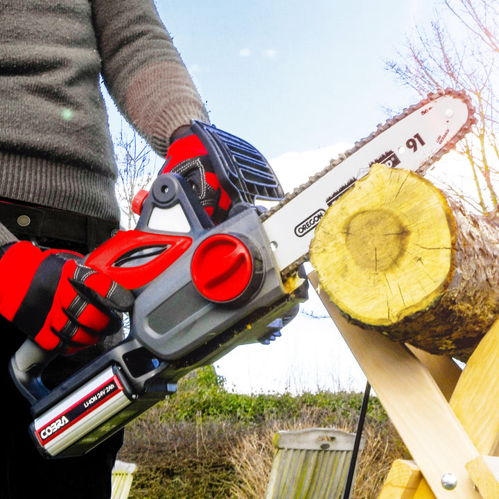 Cobra CS1024V chainsaw in use